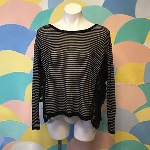 Long sleeve Free people black and white stripped top size XS with lace on side.